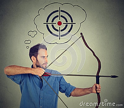 Determinate business man with bow and arrow. Stock Photo