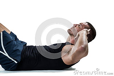 Determined athlete doing crunches Stock Photo