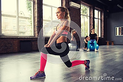 Blonde girl working out at a gym Stock Photo