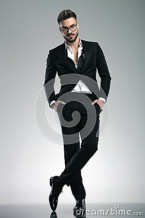 Determined man standing with his legs crossed Stock Photo