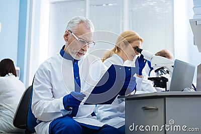 Determined researchers analysis genes in the lab Stock Photo