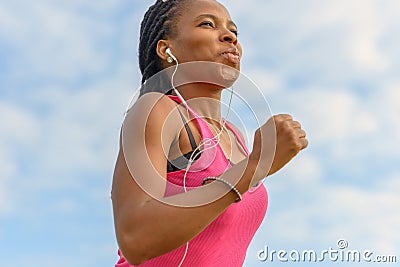 Determined young African woman working out jogging Stock Photo