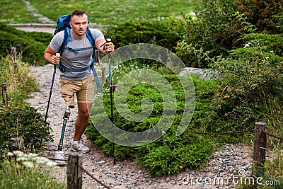 Determined young man with prosthesis enjoying port activities Stock Photo