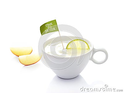 Detox diet, yoghurt in cup with lemon and flag text time to detox on white background Stock Photo