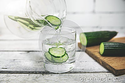 fresh cucumber water pouring into a glass Stock Photo