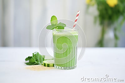 detox green shake with cucumber and celery sticks on side Stock Photo