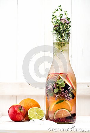 Detox Water Summer lemonade with berries, herbs and fruits in a glass bottle Stock Photo