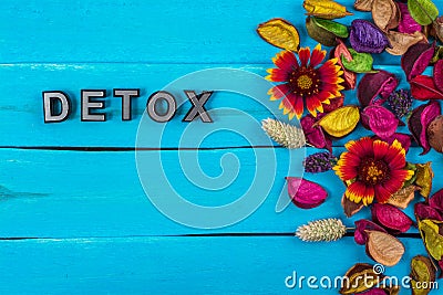 Detox word on blue wood with flower Stock Photo