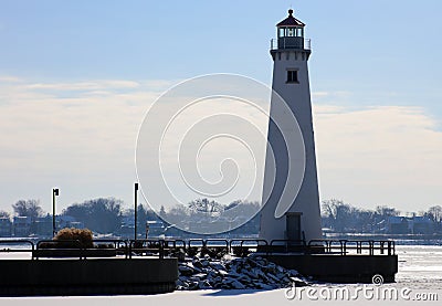 Detroit riverfront lighthouse during cold winter facing Canada Stock Photo