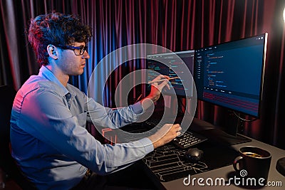 IT developer pointing online software information coding on pc screen. Gusher. Stock Photo