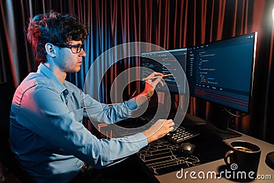 IT developer pointing online software information coding on pc screen. Gusher. Stock Photo