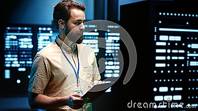 Developer in server room Stock Photo