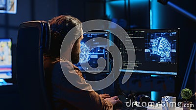 Developer uses computer to update artificial intelligence neural networks Stock Photo