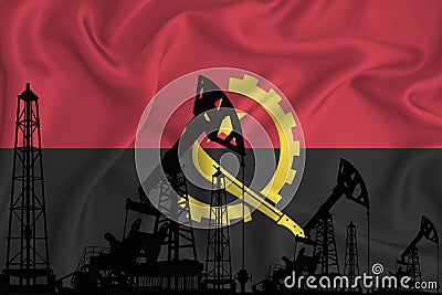 Developing Flag of Angola. Silhouette of drilling rigs and oil rigs on a flag background. Oil and gas industry. The concept of oil Stock Photo