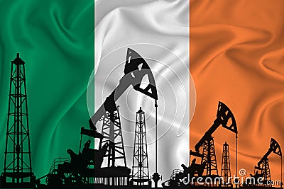 Developing Flag of Ireland. Silhouette of drilling rigs and oil rigs on a flag background. Oil and gas industry. The concept of Stock Photo