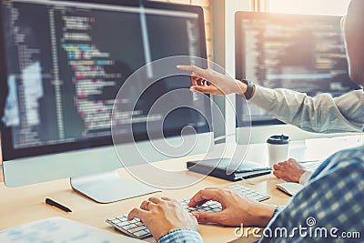 Developing programmer Team Development Website design and coding technologies working in software company office Stock Photo