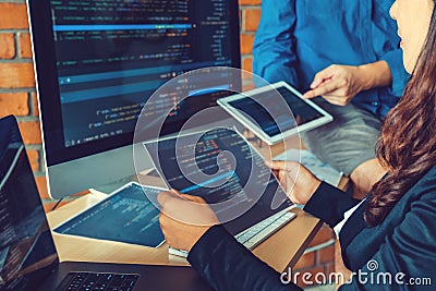 Developing programmer Team Development Website design and coding technologies working in software company office Stock Photo