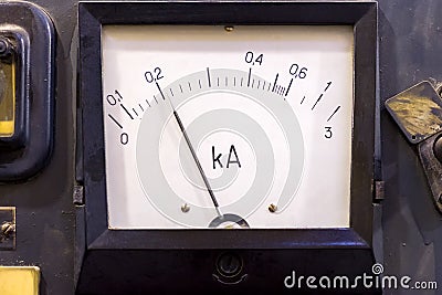 The device is an analog ammeter in the dashboard. Stock Photo