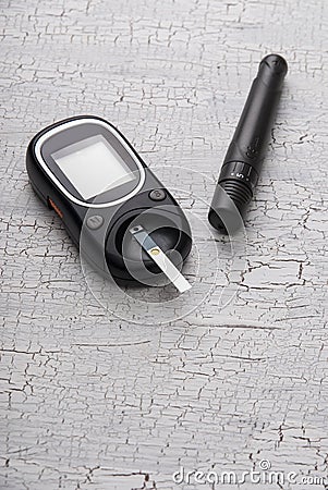 Device for measuring blood sugar on table Stock Photo