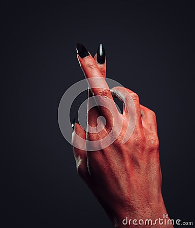 Devil hand with gesture cross fingers Stock Photo