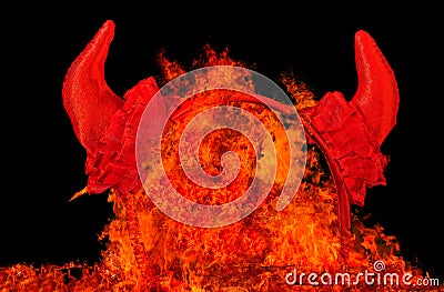 Devil party horns in fire flames. Stock Photo