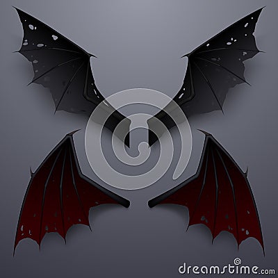 Devil wings with shadow on gray background Stock Photo