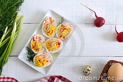 Deviled eggs. Delicious appetizer. Boiled eggs stuffed with yolk, mustard, mayonnaise, paprika. Classic recipe. Stock Photo