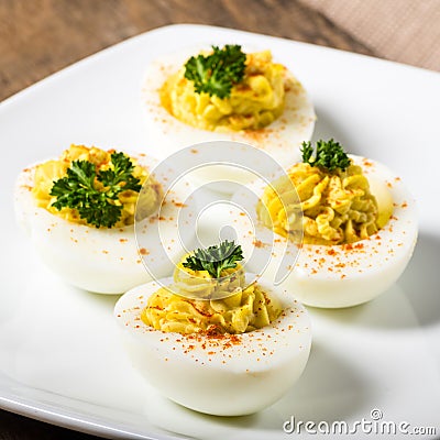 Deviled eggs garnished with parsley and paprika Stock Photo