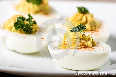 Deviled eggs garnished with parsley and paprika Stock Photo