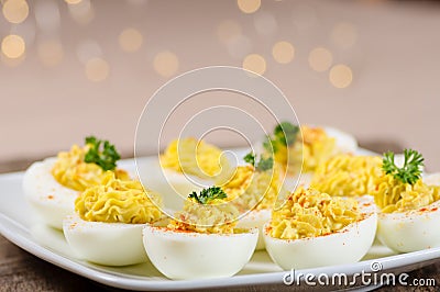 Deviled eggs garnished with parsley and paprika Stock Photo