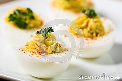 Deviled eggs garnished with parsley and paprika Stock Photo