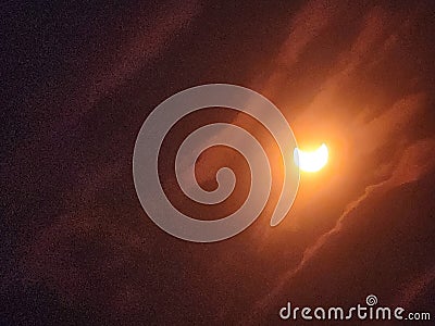 Devilish moon in a cloudy sky at night Stock Photo