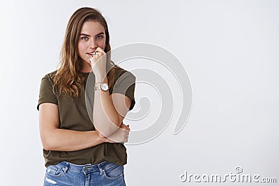 Devious creative intrigued charming european woman have plan thinking biting finger looking mysterious thoughtful Stock Photo