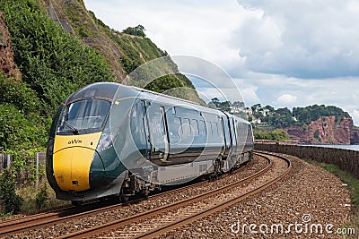 A GWR express train on the coastal railway en route to Teignmouth Editorial Stock Photo