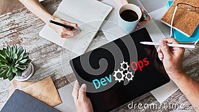 DevOps - development cycles of Automation and monitoring at all steps of software construction. Stock Photo