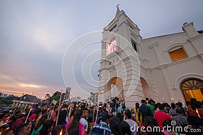 Devotees attend with white candle during last day of St Anne feast. Editorial Stock Photo