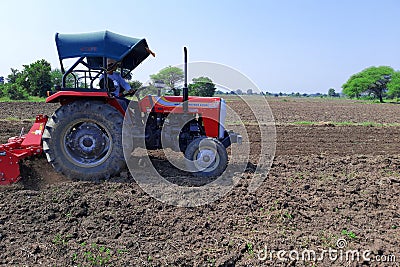 22-10-2021, Dewas, M.P. India. Plowing the field with a tractor, farmers preparing the field before sowing the crop, a new Editorial Stock Photo