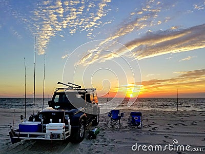 Dewey Beach, Delaware, U.S - September 5, 2020 - A black Jeep equipped with fishing items during early morning sunrise Editorial Stock Photo