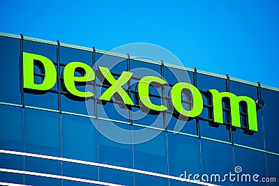 Dexcom logo sign atop headquarters campus. DexCom, Inc. develops, manufactures, and distributes glucose monitoring systems for Editorial Stock Photo