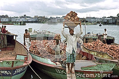 Dhaka cityscape with workers, slum,river and boats Editorial Stock Photo