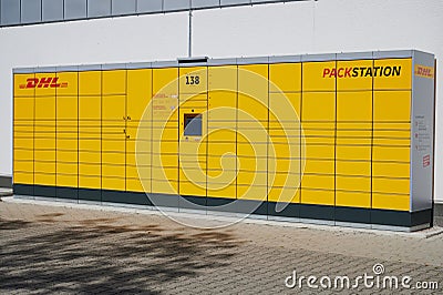 DHL pickup location German name: Packstation, logistics company Deutsche Post DHL Group Editorial Stock Photo