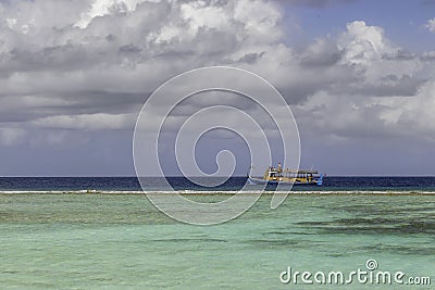 Dhoni in front of a wonderful beach in maldives Stock Photo