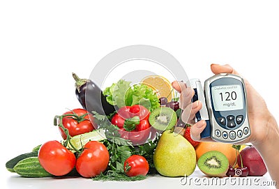 Diabetes concept glucose meter fruits and vegetables Stock Photo