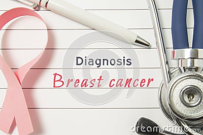 Diagnosis Breast Cancer. Pink ribbon as symbol of struggle with cancer and stethoscope lying on medical form with text labels Diag Stock Photo