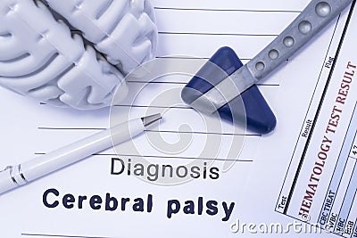 Diagnosis Cerebral palsy. Figure brain, neurological hammer, printed on a paper blood test and written diagnosis of Cerebral palsy Stock Photo