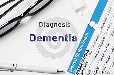 Diagnosis of Dementia. Results of mental status exam, container with crumbled pills with inscription psychiatric diagnosis Dementi Stock Photo