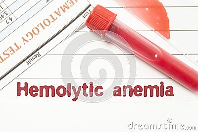 Diagnosis Hemolytic Anemia. Notepad with text labels Hemolytic Anemia, laboratory test tubes for the blood, blood smear for micros Stock Photo