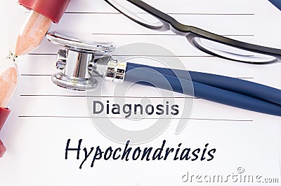 Diagnosis Hypochondriasis. Psychiatric diagnosis Hypochondriasis is written on paper, on which lay stethoscope and hourglass for m Stock Photo