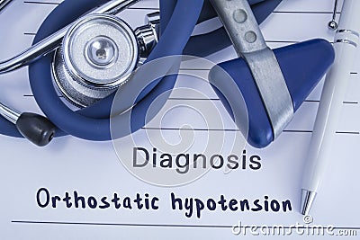 The diagnosis of orthostatic hypotension. Paper medical history with diagnosis of orthostatic hypotension, on which lie blue steth Stock Photo