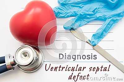 Diagnosis Ventricular septal defect. Figure heart, stethoscope, surgical scalpel and gloves are near title Ventricular septal defe Stock Photo